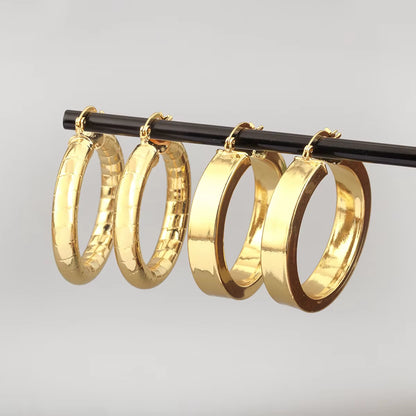 AuraHoop™ Bold Copper Circle Earrings – Four Styles of Effortless Elegance